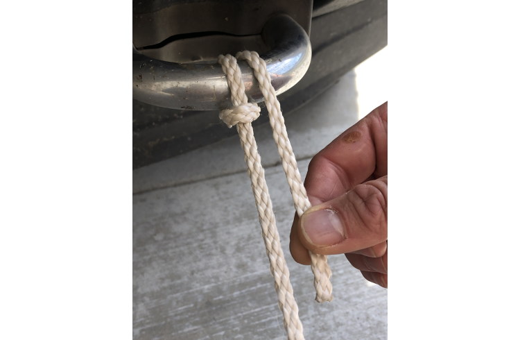 The Munter hitch knot with a carabiner clipped through the loops.