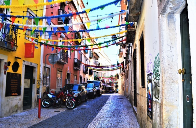 A cobbled street with colorful decorations