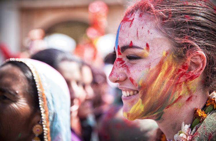 A foreign traveler takes part in Holi festival activities in Rajasthan, India.