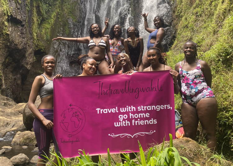 A group of women hikers at a waterfall in Kenya.