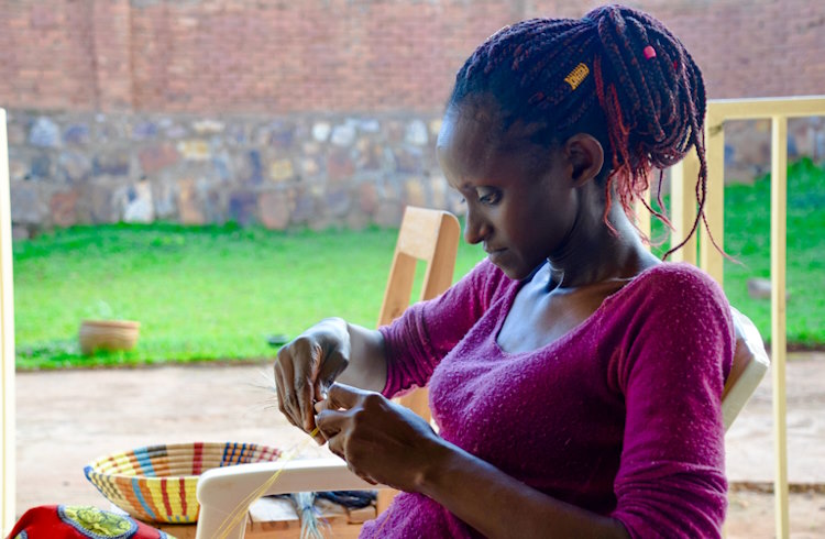 A Rwandan woman teaches a weaving workshop in Kigali, Rwanda.