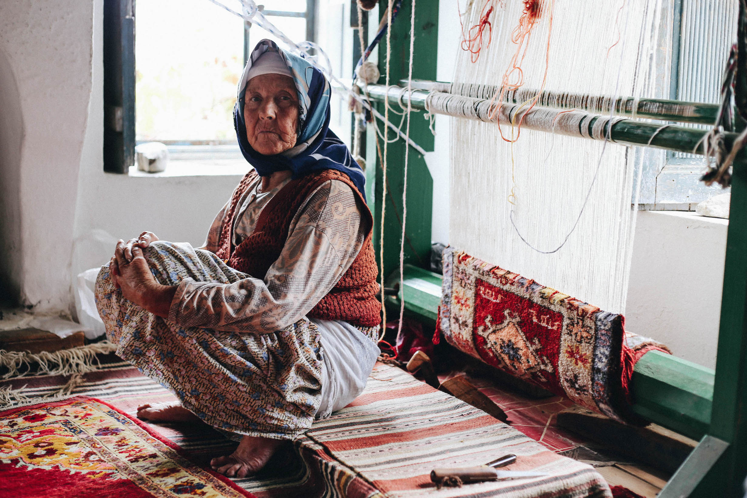 The most experienced weaver, 83 y.o. Gulsum, says that carpet is a diary for local women. With patterns they express feelings and explain their life. On her 1st carpet Gulsum made a girl with a book, when her father didn't allow her to enter school. 