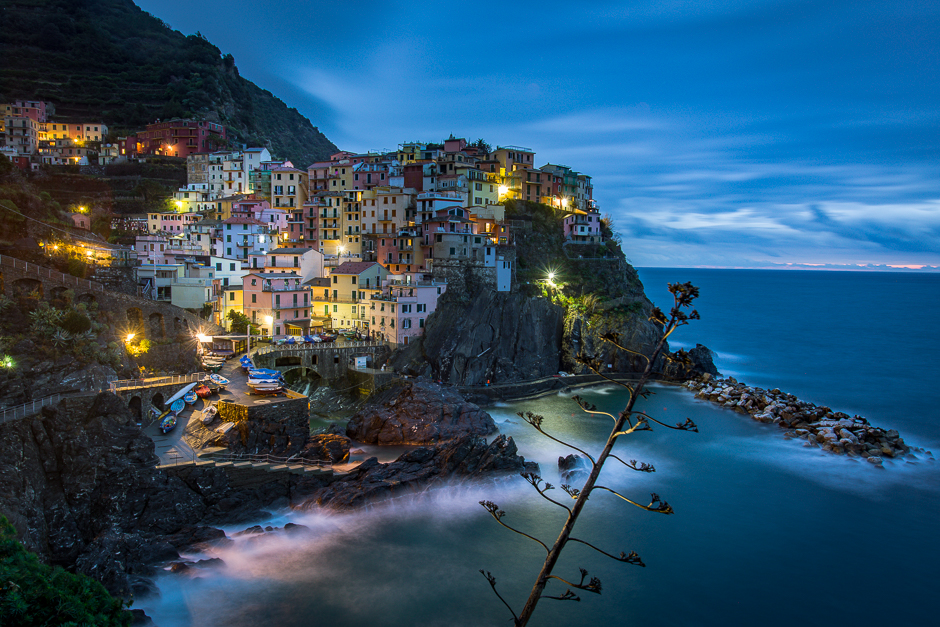 An early morning train ride after a sleepless night led to a break in the multiple day storm just in time for the morning blue hour at beautiful Manarola.  
