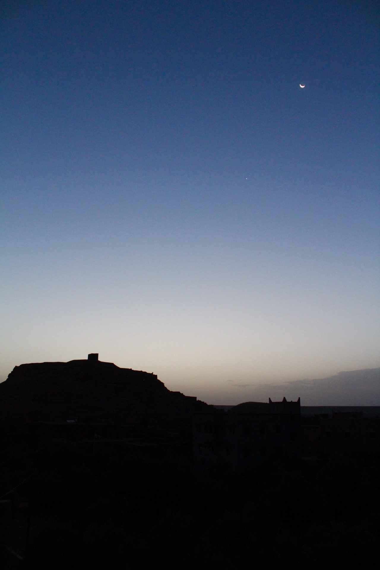 Sunrise over Ait Ben Haddou: The cool colors and sharp lines of the image are a contrast to the warm tones seen in other photos of the fortress.