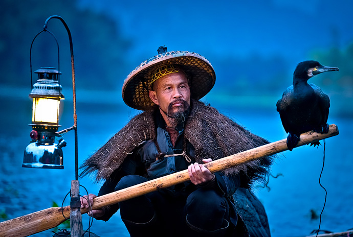 Meet "Blackbeard;" one of the last fishermen demonstrating the dying art of using cormorant birds to catch fish on the Li River. The ancient tradition dates back to 960 A.D. and is scarcely used anymore except by a select few fishermen.