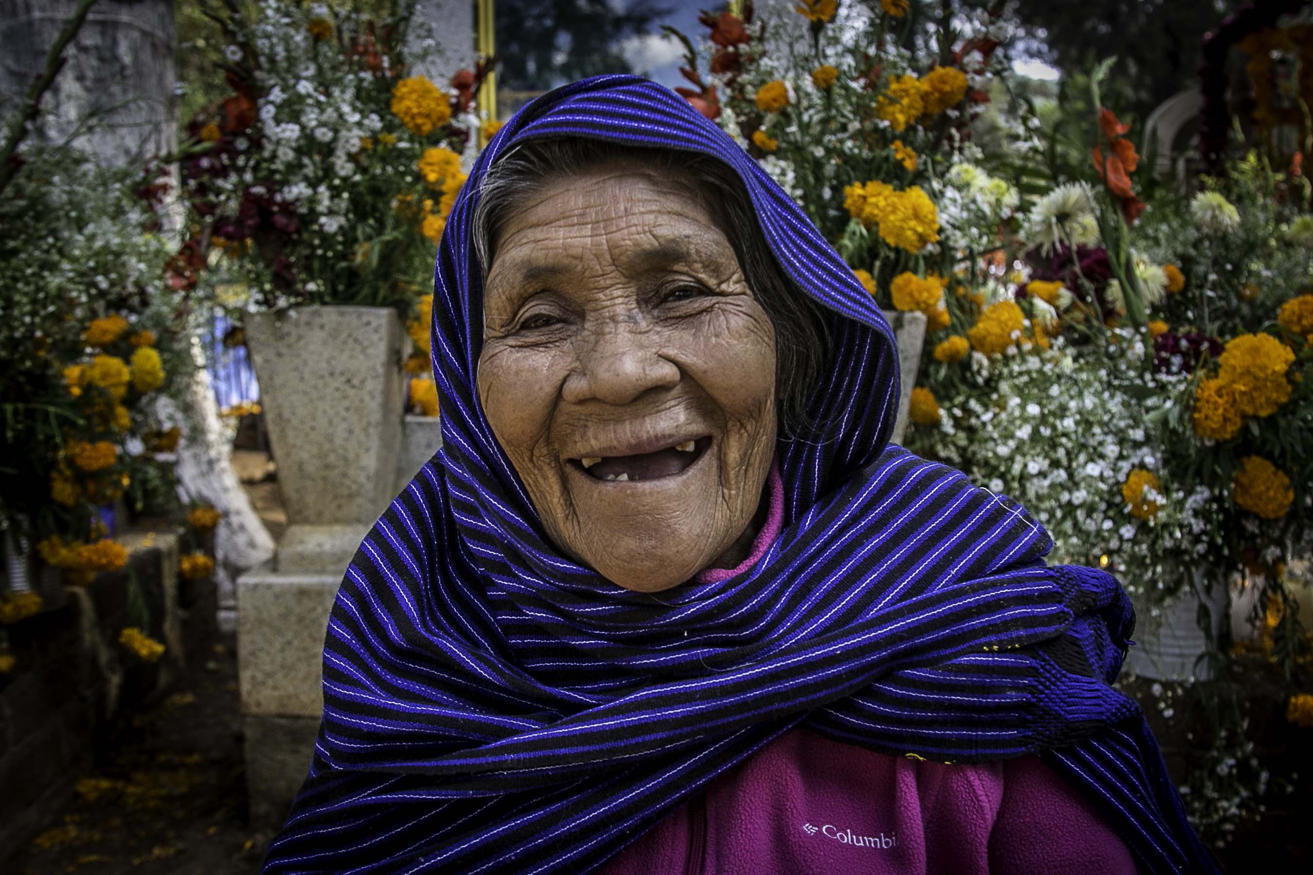 Maria Josefina's smile exemplifies the spirit of "Dia de los Muertos". She invited me for a mezcal, all while she shared her Purépecha ancestry, her love for her grandchildren, her aching in her bones, and her beautiful smile. 