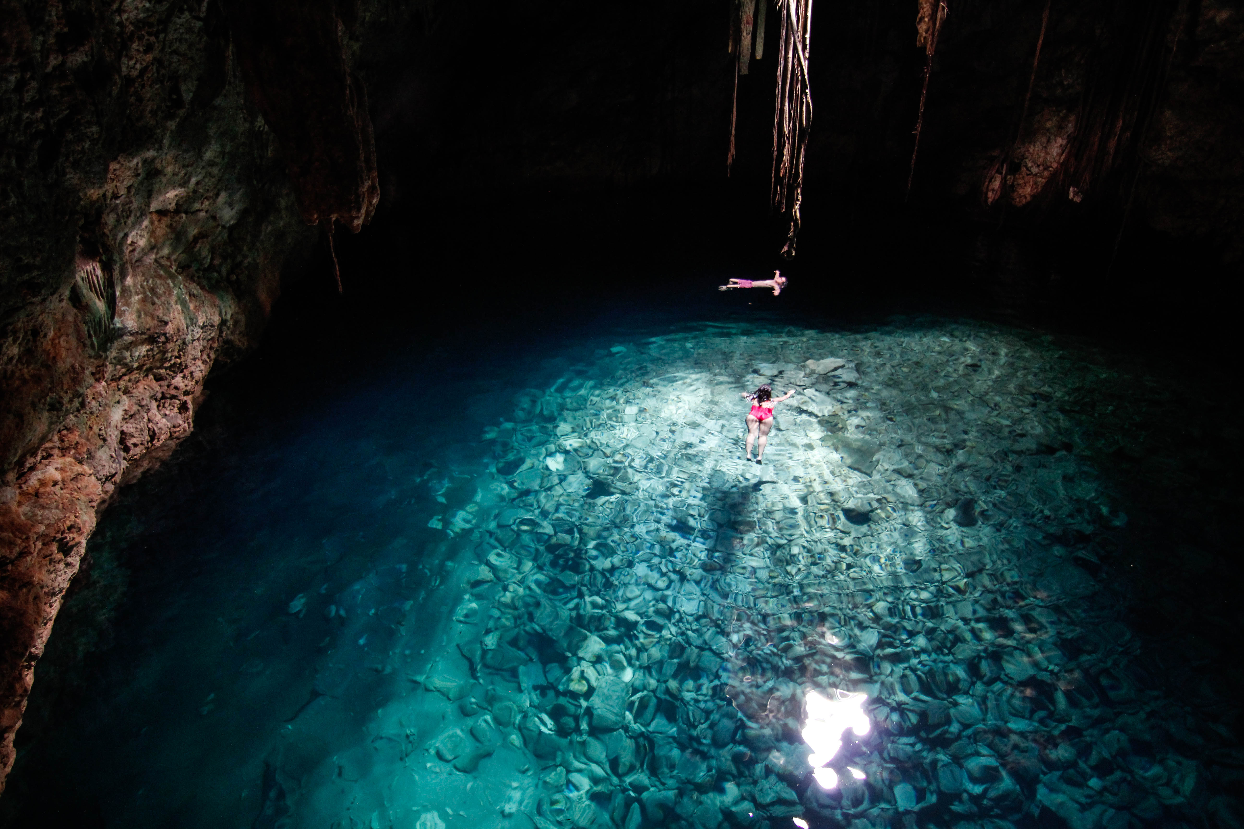 In the peninsula of Yucatan there are more than seven thousand natural freshwater pools, called cenotes. This one is in Cuzama. For the Maya, the cenotes were considered sources of life and sacred places to reunite with the Gods. In the photo a woman and a man swim and relax in the cenote.