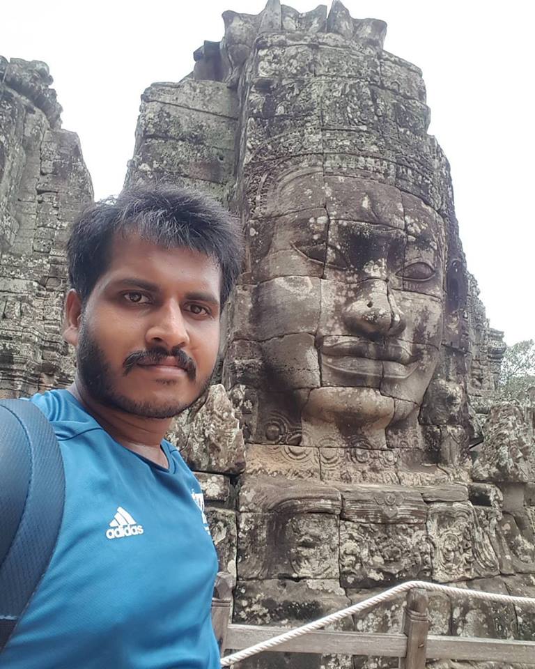 ‘When statues can smile, why can’t we.’ Selfie with the statue taken at Bayun temple, Angkor Thom, Siem Reap, Cambodia. 