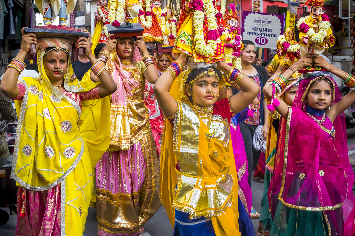Dressed in their finest, the women of Rajasthan worship Parvati, the wife of Lord Shiva, at the start of spring when harvest and marital fidelity are paramount. Idols of Parvati are adorned and carried through the streets in a grand procession by girls, young and older women alike.