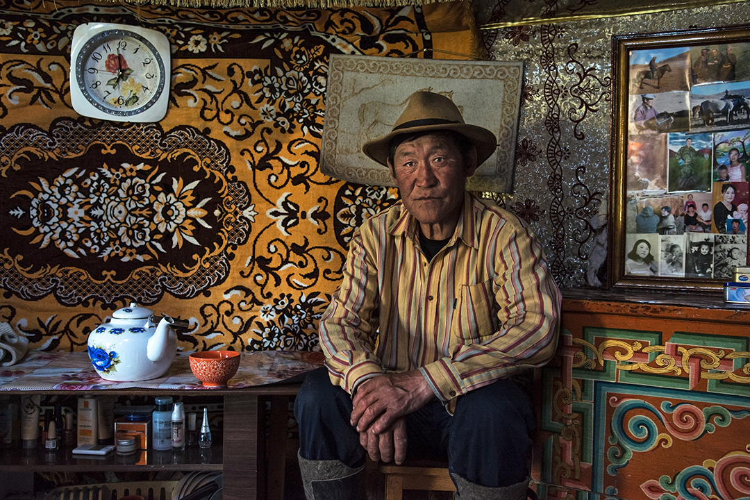 A man within his own Gher just finished drinking the airag, the typical Mongolian drink made with fermented milk. 