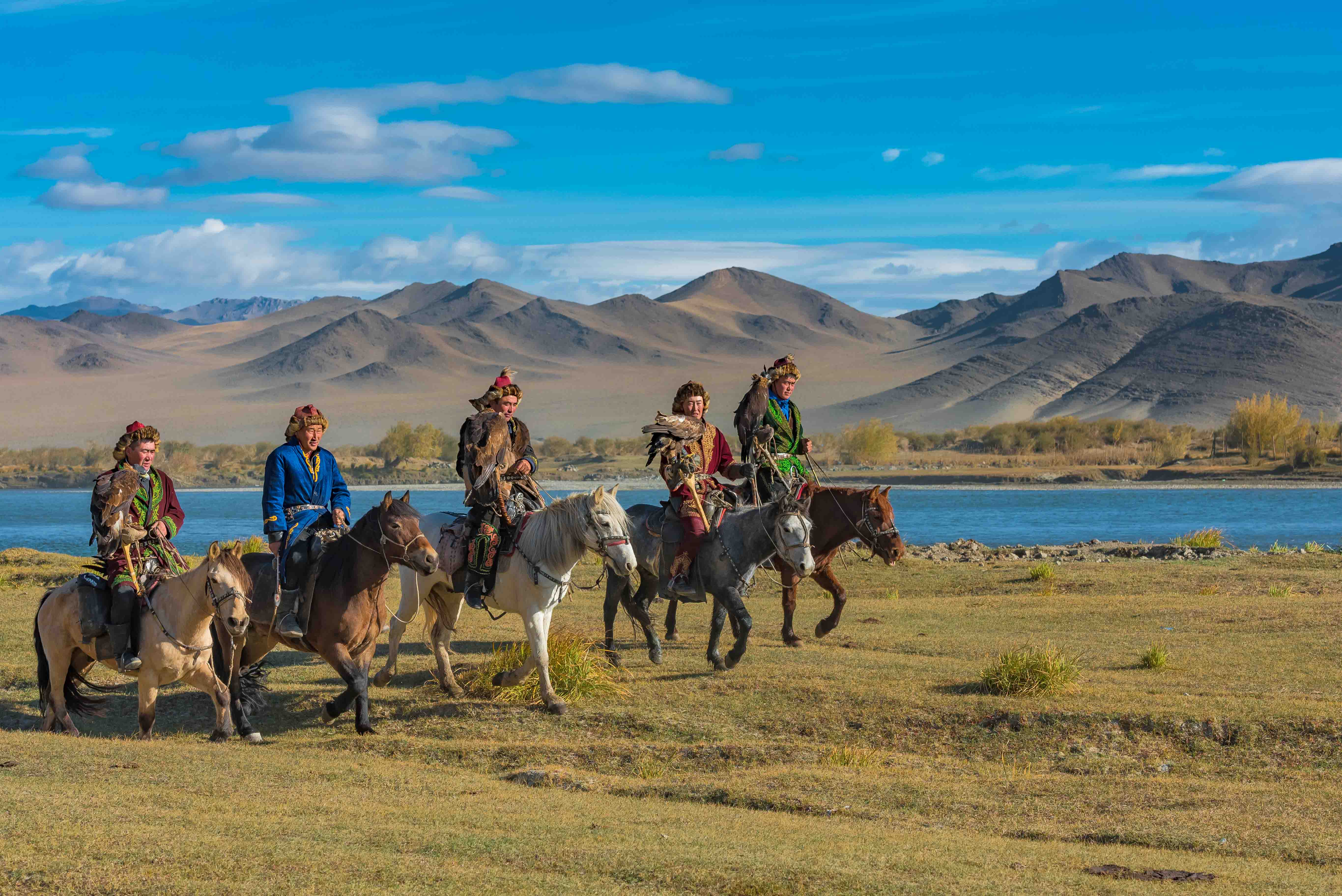 Golden Eagle hunters from up to 200 km away in Mongolia, Russia and Kazakhstan arrive on horseback with nothing more than their eagle and the clothes on their backs.