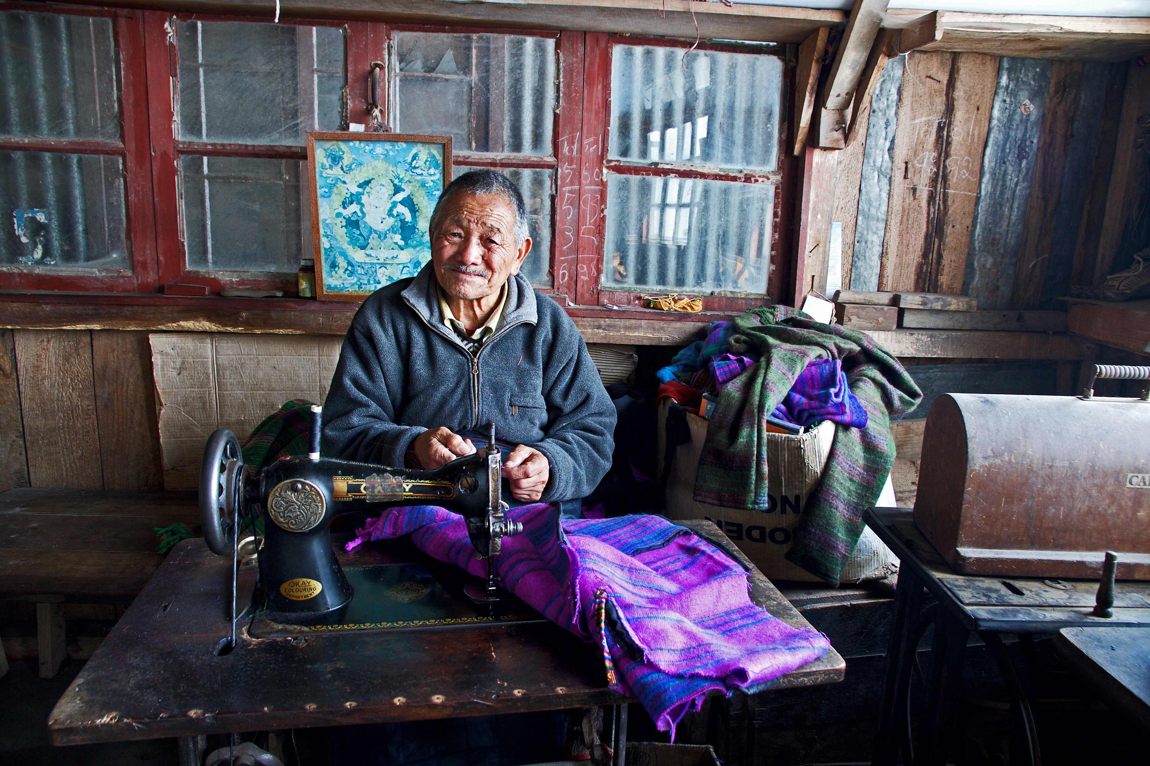 Tibetan Refugee Self-Help Centre is an orphanage, monastery, clinic and home for the aged, in one complex. Visitors can see products made, then buy them, the money going back into the centre. Here, I came across the most joyful of gentlemen, making jumpers as bright and beautiful as his face.
