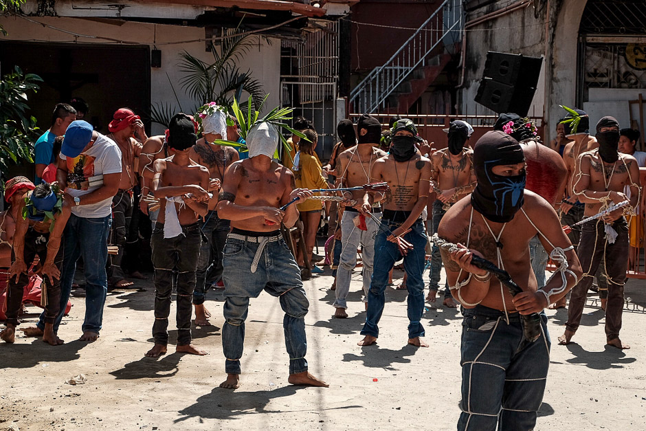 Barangay Tolentino in one of Metro Manila’s City – Pasay City is where, during Holy Week. These group of flagellants are preparing for Good Friday events -- walking along the burning street, whipping their blood-soaked body under the warmth of summer sun. 