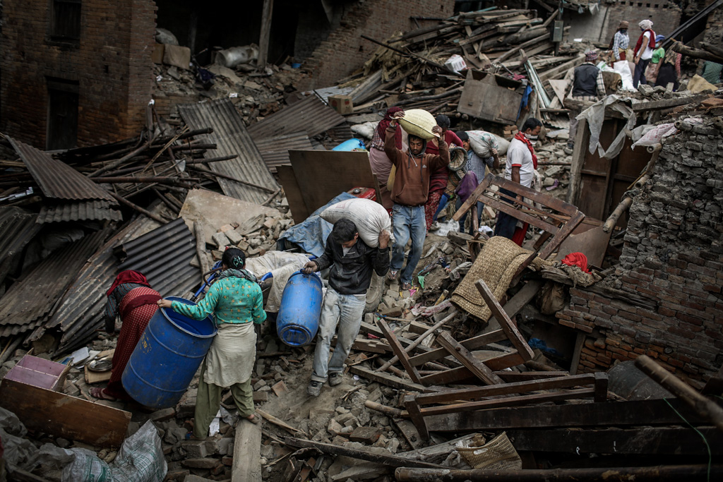 People of Bhaktapur are collecting their households from the collapsed building after earthquake. Bhaktapur, Kathmandu, Nepal. May 1, 2015