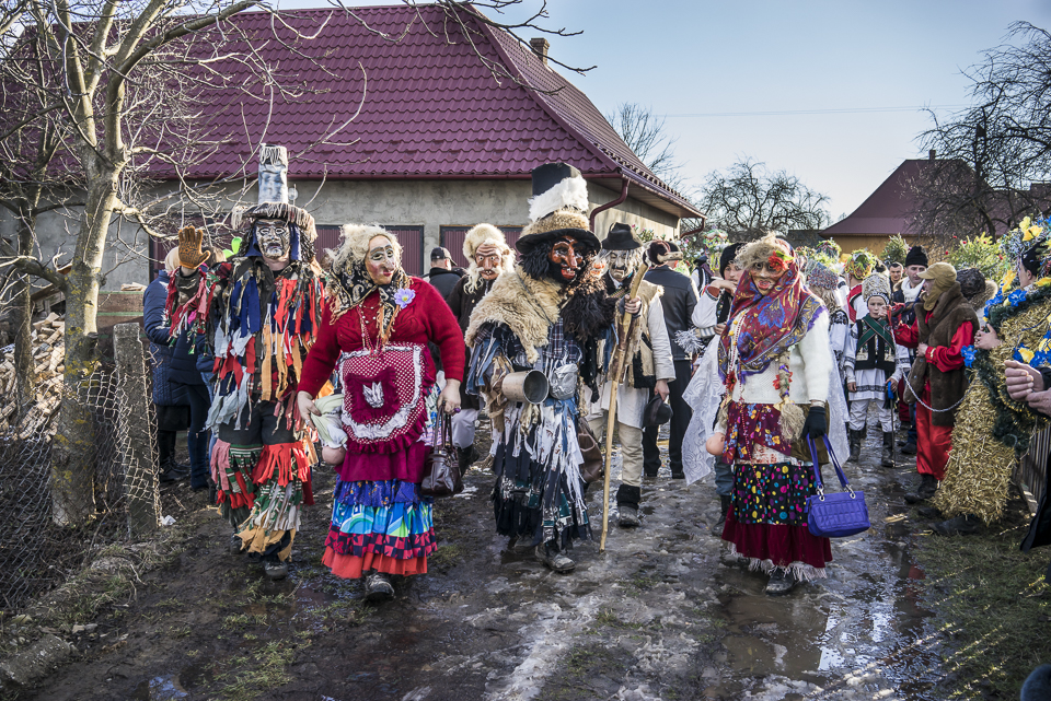 A group of dressed villagers preparing to join the parade through the city during the festival Malanka in Krasnoilsk, Chernivtsi region, Ukraine