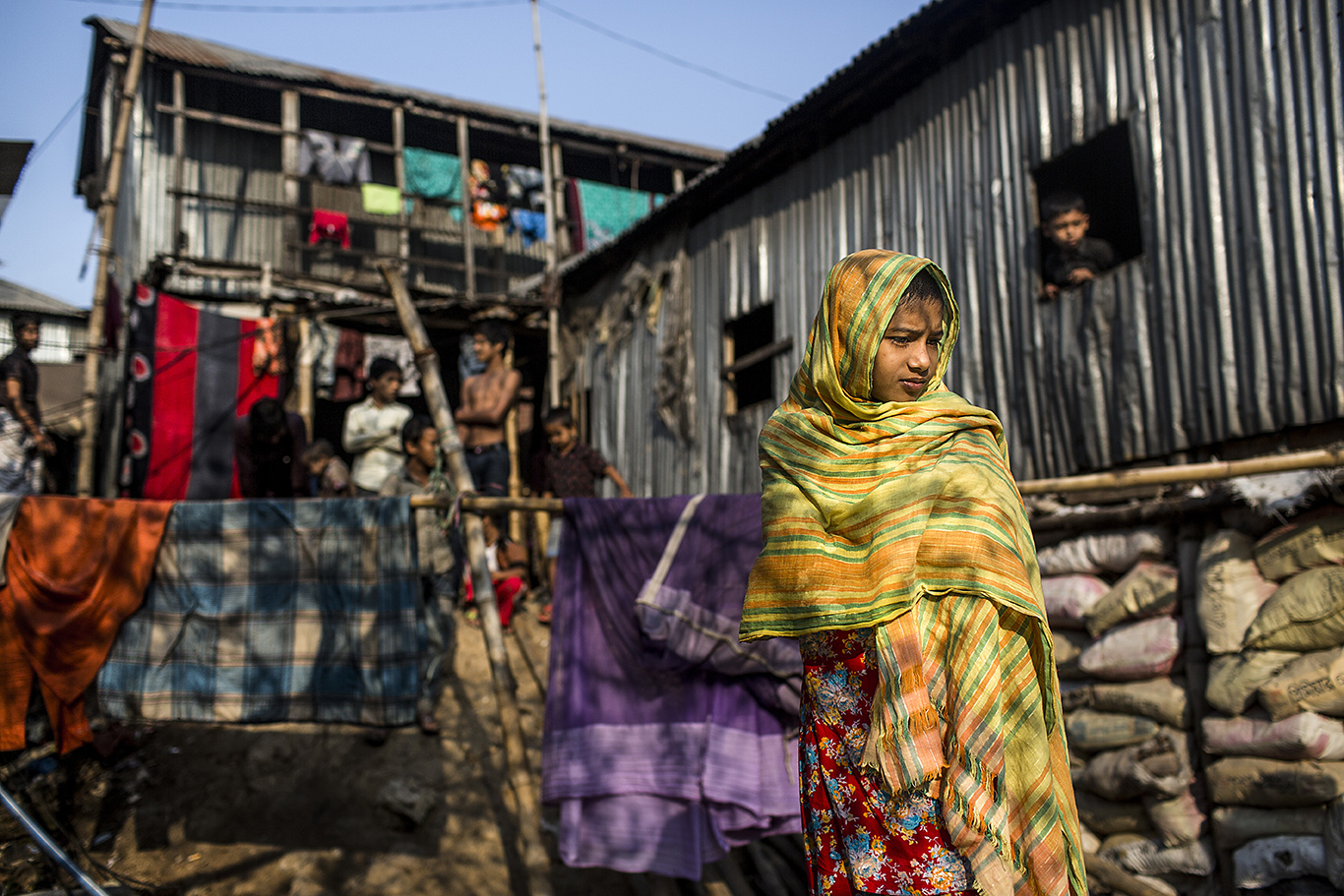 A thoughtful girl is seen in the Korail slum of Dhaka, Bangladesh. Korail Bosti is the largest slum in Dhaka, and the slum dwellers live under constant threat of eviction by the competent authorities. Dhaka has been named, according to several reports, the worst city in the world to live in.