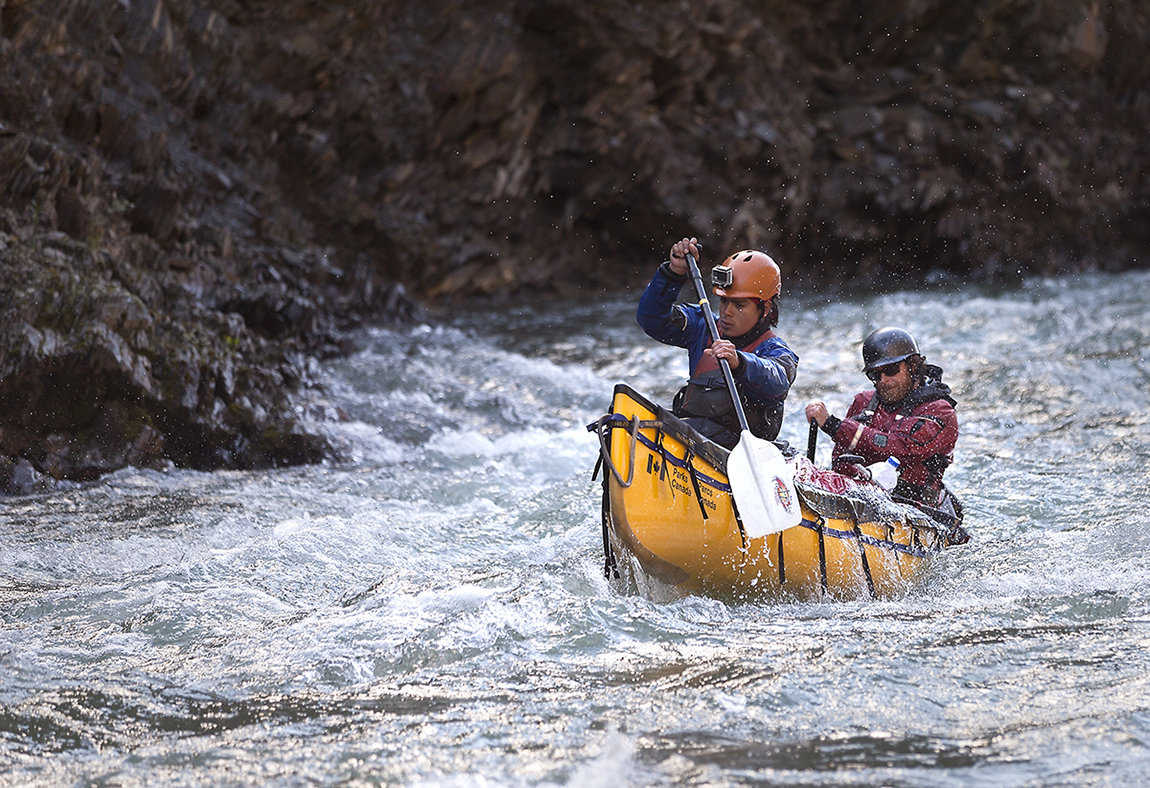 Two experts paddle a canoe through one of the most intense canyons of the trip.