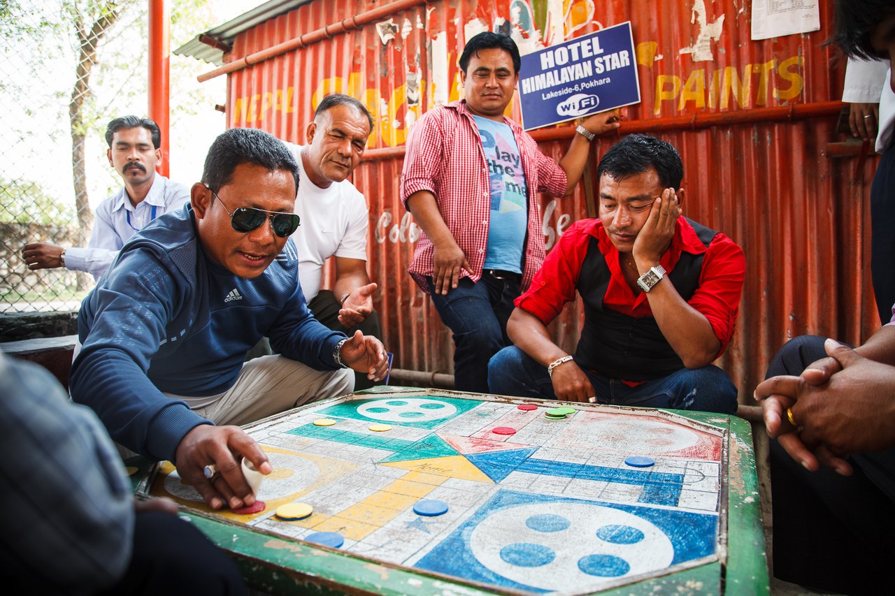 Until there is no tourists, travel guides playing ludo on a bus stop.