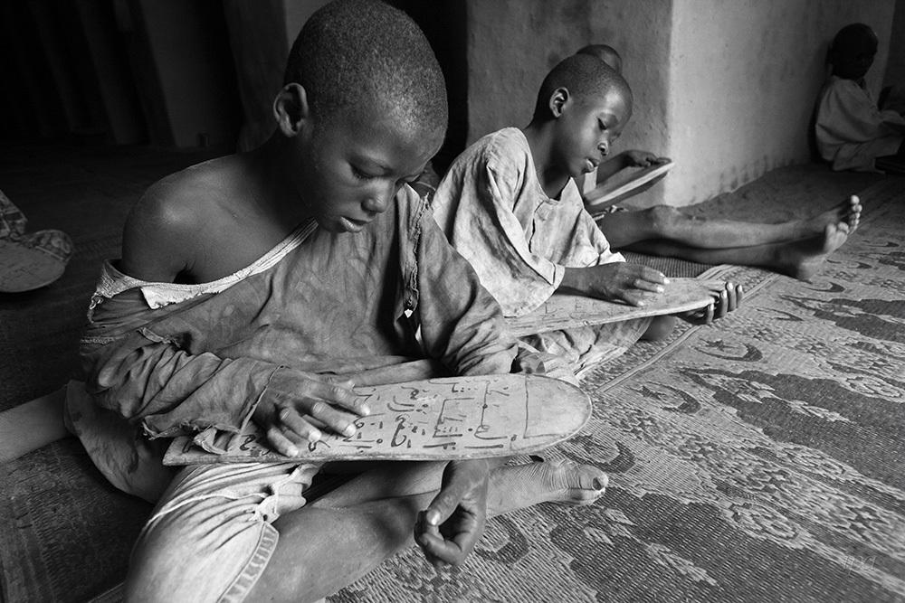 Reading inside the grand mosque of Djenne