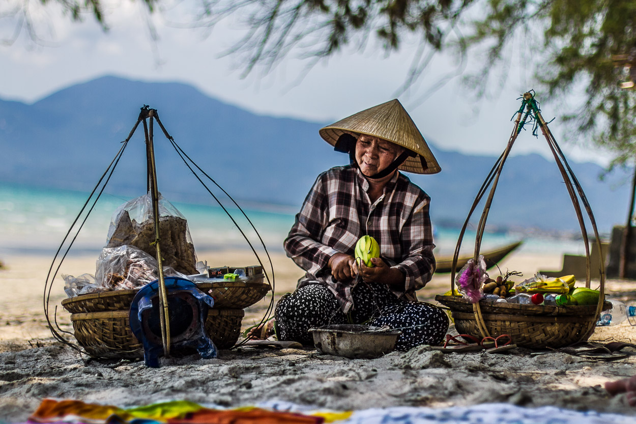 A lovely elderly woman who speaks only 10 words in English and sells fruit on the beach in Hoi an, Vietnam.