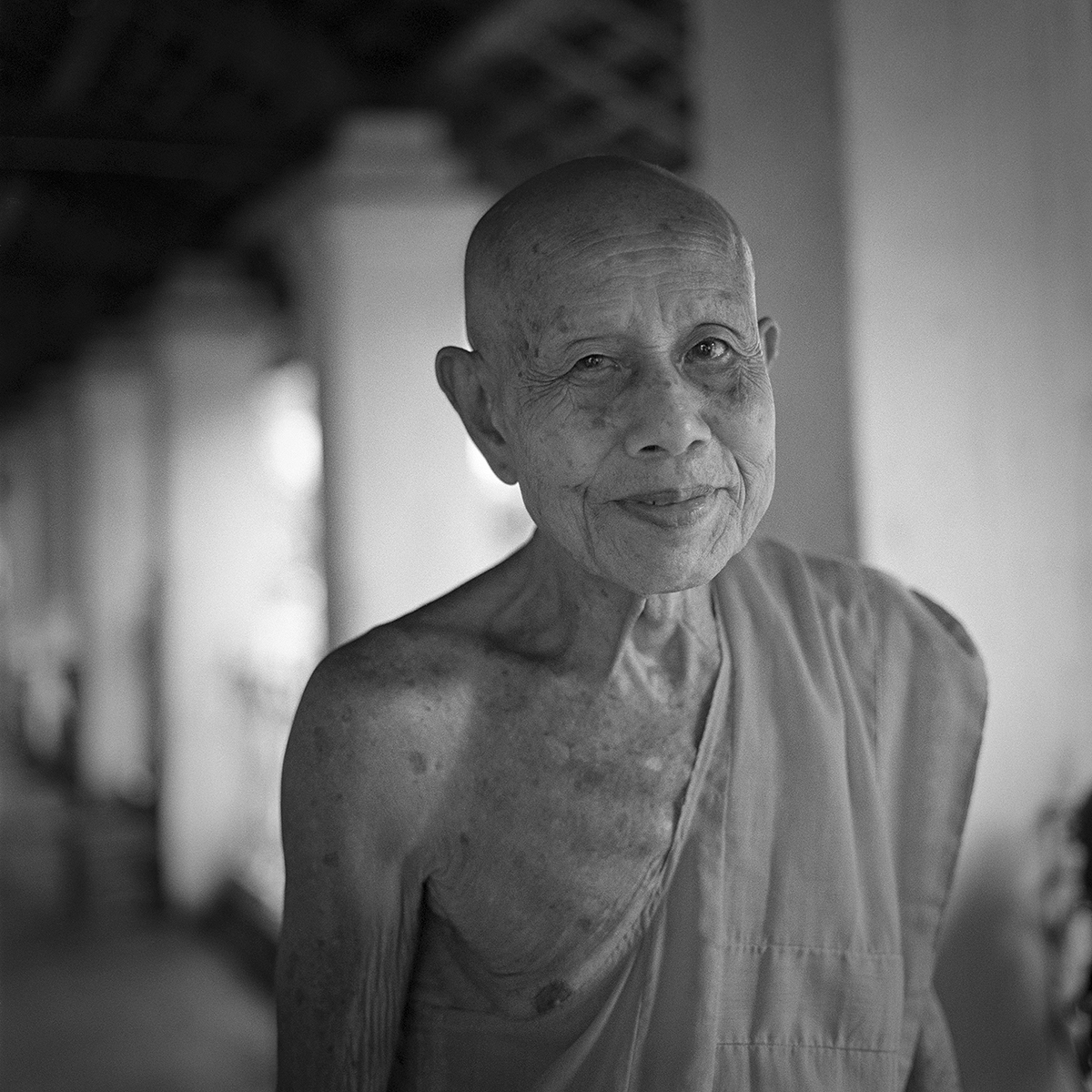 A old monk is in monastery. This portrait mean the way of life. I would like to be like this man.