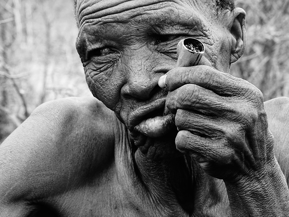 I did not need to become fluent in Khoisan, the complex 'click' based language of Botswana's San bushmen, in order to understand their story.  There is strength in the San's eyes, and in each wrinkle: history.  An etching of a life lived.