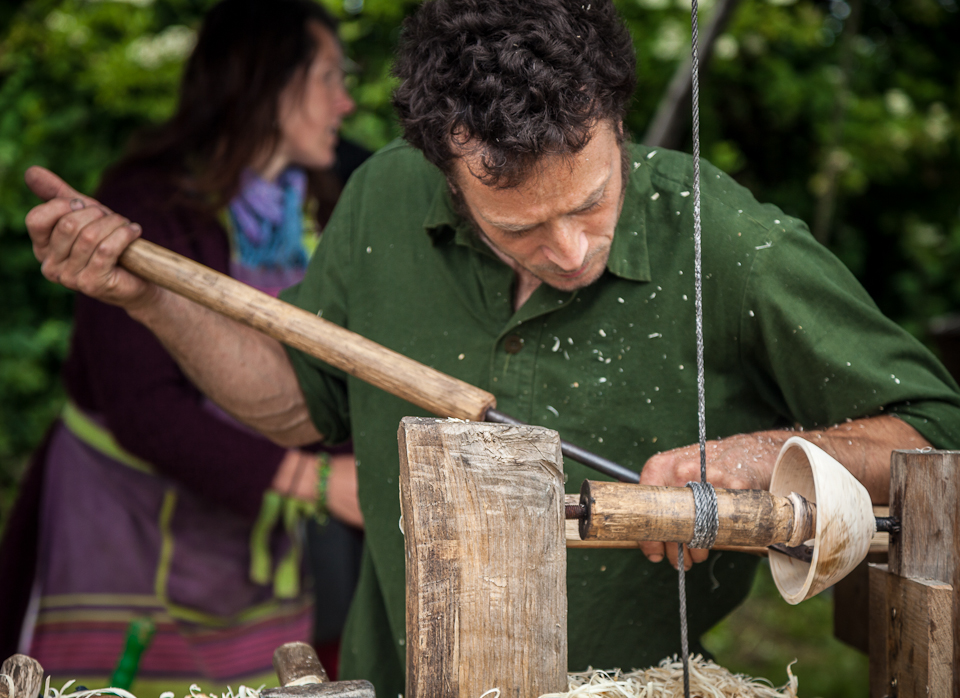 Matt Whittaker demonstrates his green woodwork skills at the Newcastle Green Festival, June 2014.  One of the ways the members of the co-op make a living is by offering courses and demonstrations of their many different crafts. The wood used is coppiced from their 400 year old woodland.