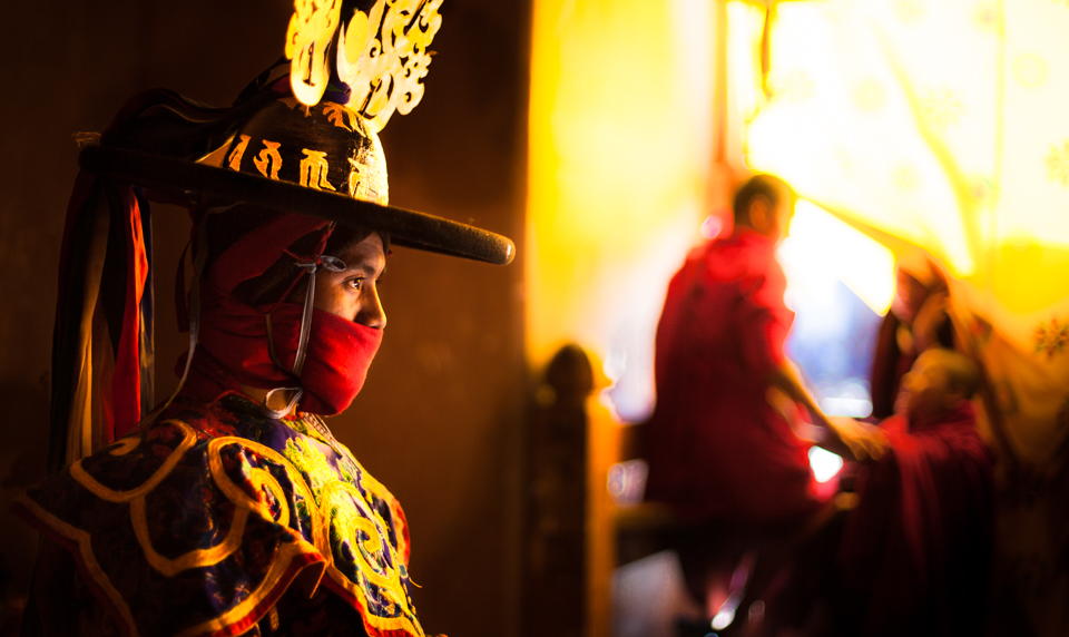 A Buddhist monk dresses for a black hat dance inside Gangtey Monastery in Phobjikha during the Black-Necked Crane Festival. The dance has mysterious origins in Tibet, Bhutan's neighbor to the north, as it was once secret and used to pass white and black magic however in Bhutan it signifies the severing of demon spirits.