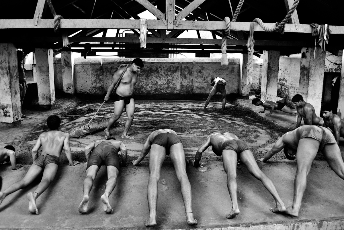 Wrestlers or Pehelvans ( Hindi ) exercising in mud arena. Training in mud arena has been followed since hundreds of years in all over India.