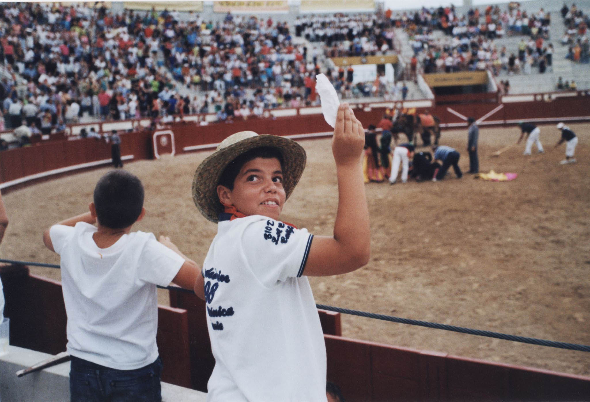 About twelve years old, this young man waves white to show the judges what he thinks of the fight-the bullfighter should have an ear. The colour shift is Portra's alone, this is an unedited scan from a postcard-sized print.