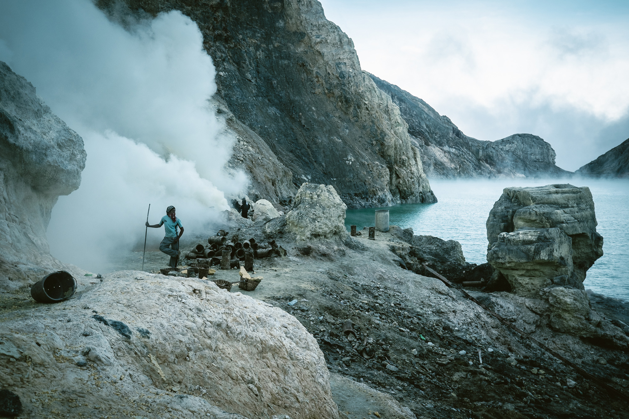 The miners are exposed to deadly gasses bellowing out from the active volcano and toxic lake. They are often enveloped by thick plumes of noxious smoke that trap them, leaving them choking for breath until the wind clears the poisonous cloud.