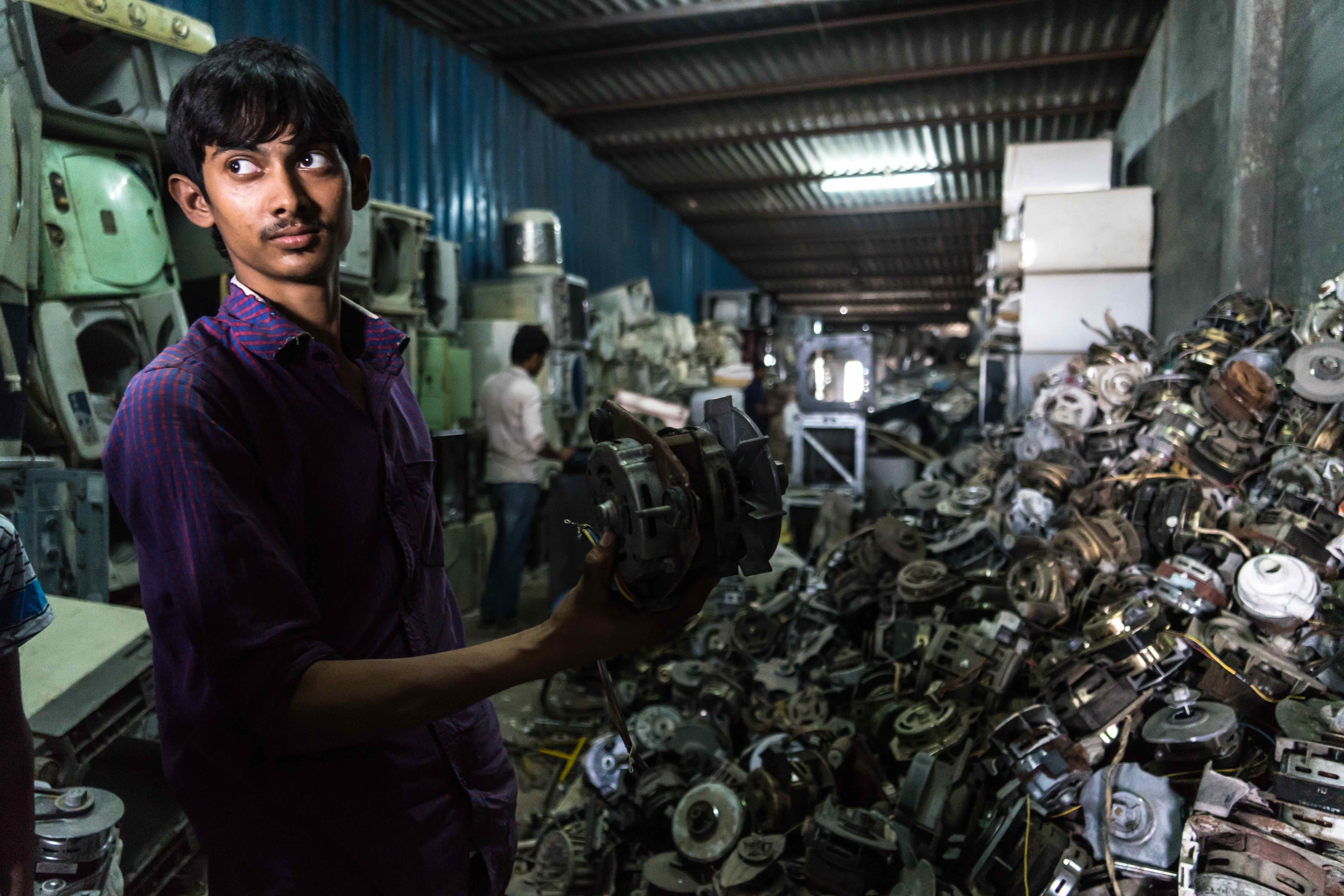 A business man who recycle copper wires from washing machine motors coming from all over India