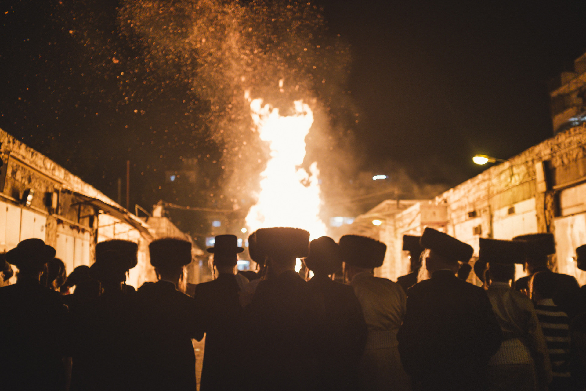 Ultra-Orthodox people pray in front of a huge bonfire during the celebration of lag BaOmer, a sacred feast that belong to the Jewish mysticism.
