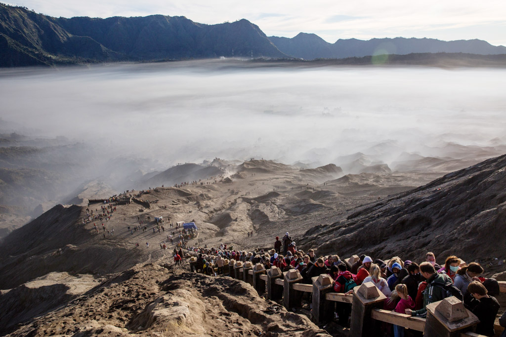 Tenggerese worshippers are seen trek across the 'Sea of Sand' to give their offerings to Mount Bromo during the Yadnya Kasada Festival at crater of Mount Bromo, Probolinggo, Java, Indonesia.