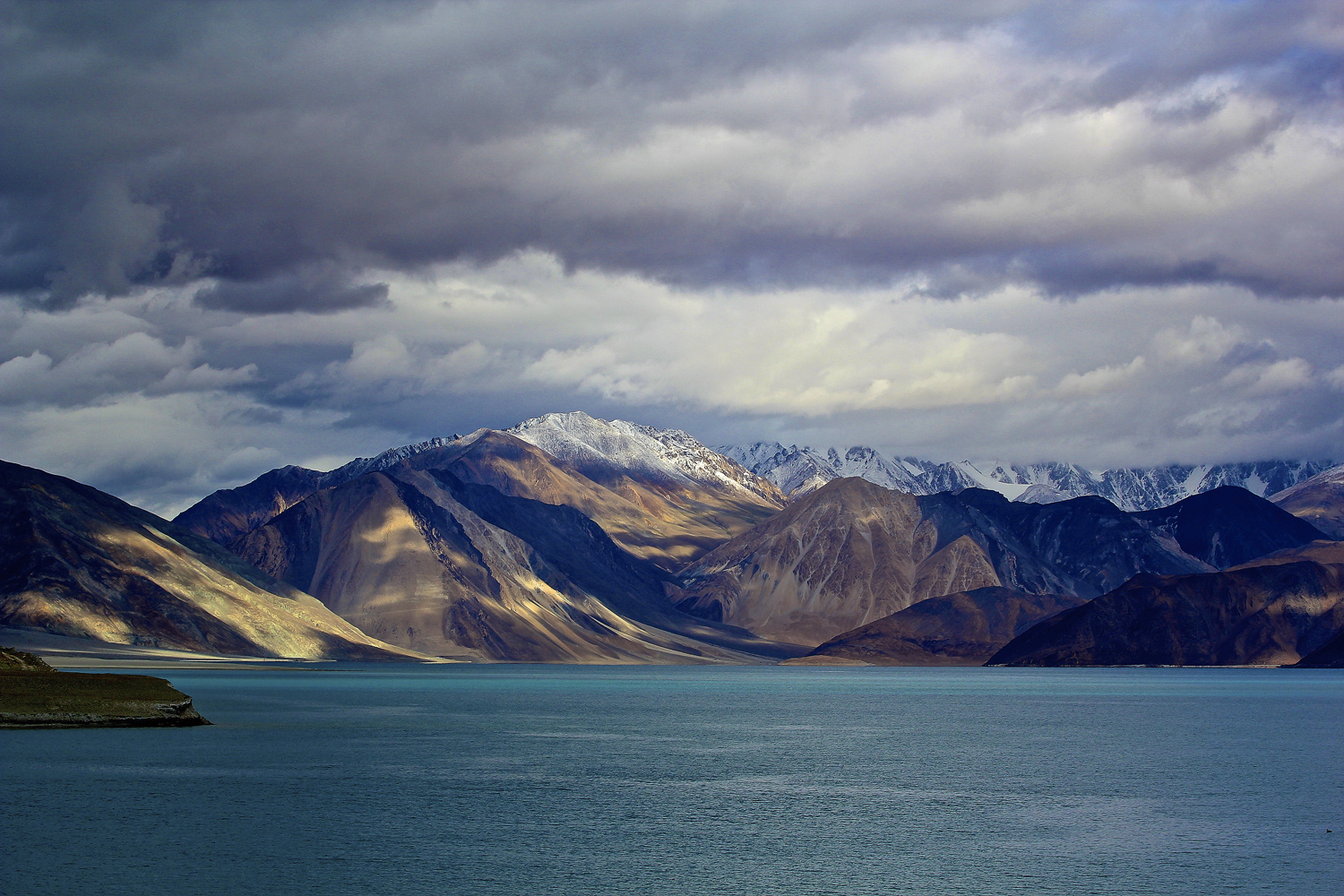 Finally reaching Pangong was such a relief, we didn't care that the weather was hiding the magnificent blue the lake is famous for, we were grateful that the 7 hour bone shaking drive was over. The land seemed barren but inviting, the forms of the mountains where hypnotic as the light fighting through the clouds danced over them.