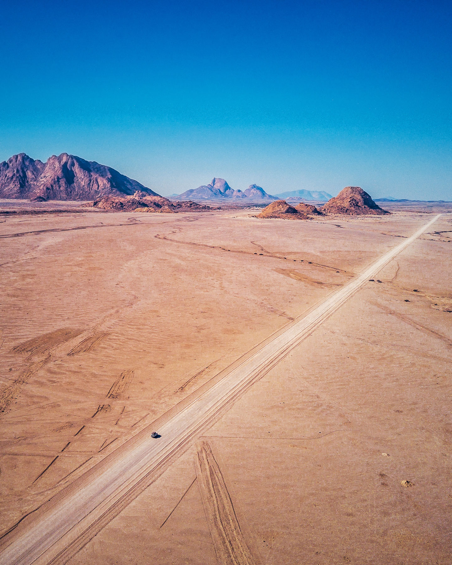 What surprised me most about Namibia was how big and empty a lot of it felt. Driving this long, straight road towards Spitzkoppe, you could drive for hours without seeing much life at all (plants, animals or even other cars).