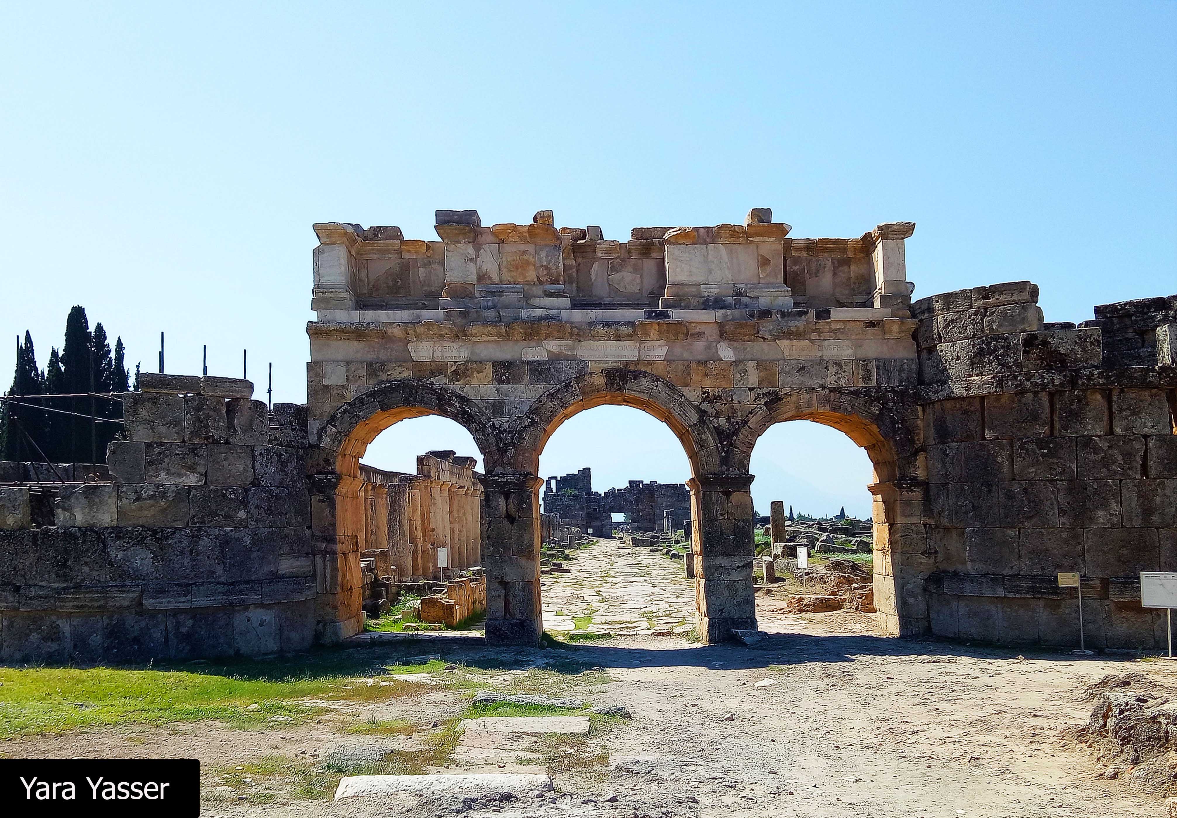 It's Frontinus Gate. This is the entrance to the Roman city with three openings and 14 m wide. It leads to North Byzantine Gate.