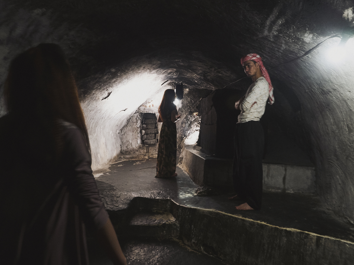 Lalish, Northern Iraq. The holy spring underneath the temple dates back 4000 years, but Yazidi culture was established by Sheikh Adi ibn Musafir al-Umawi in the 1100s. His tomb lies at the furthest point of the temple tunnels, and is under guard from a young spiritual healer-in-training.