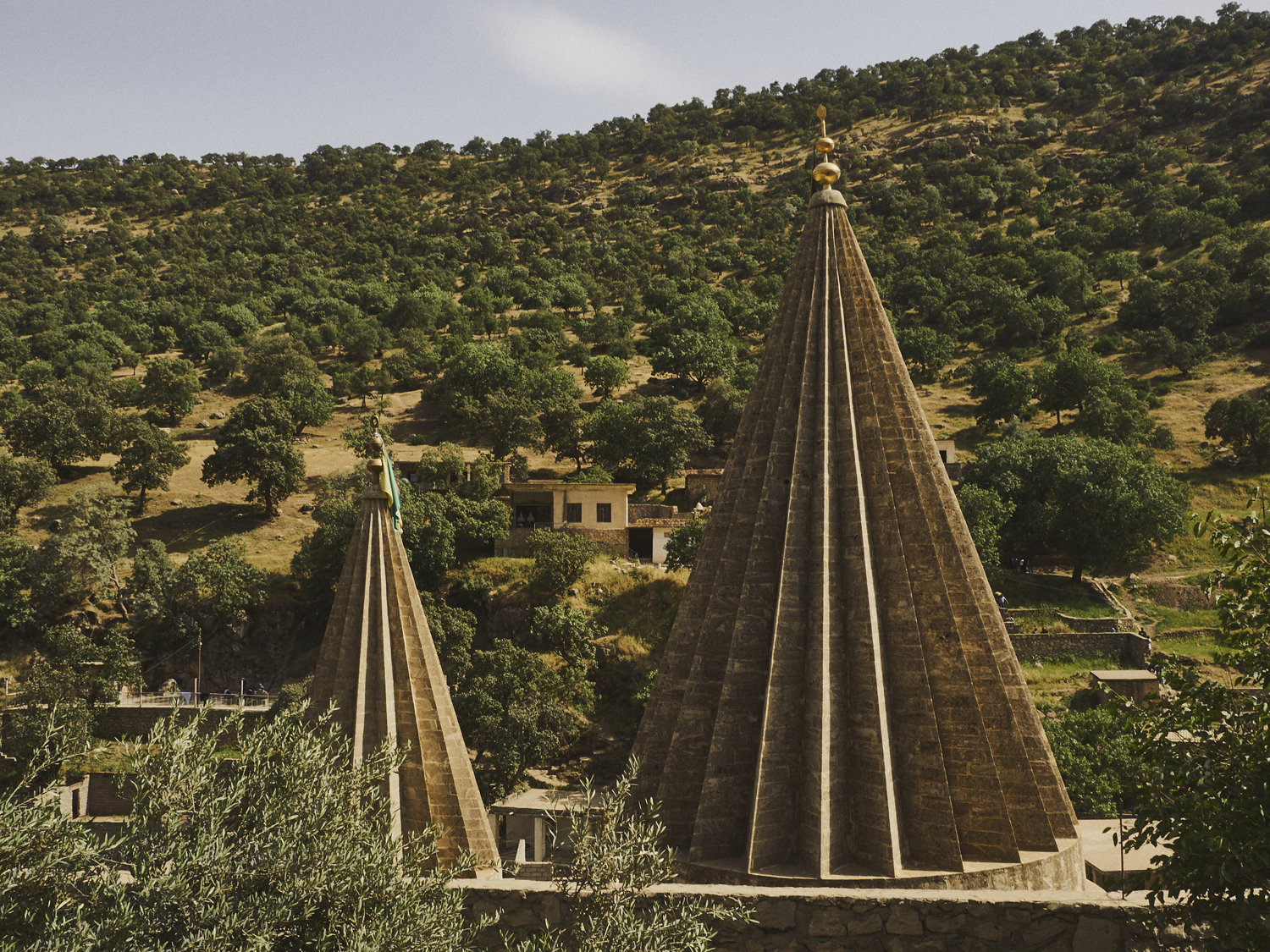 Lalish, Northern Iraq. Approximately 36 miles north of Mosul, Lalish temple is considered the Yazidi community's holiest site. The conical towers of the temple house a 4000 year old spring, and are thought to represent the rays of the sun.