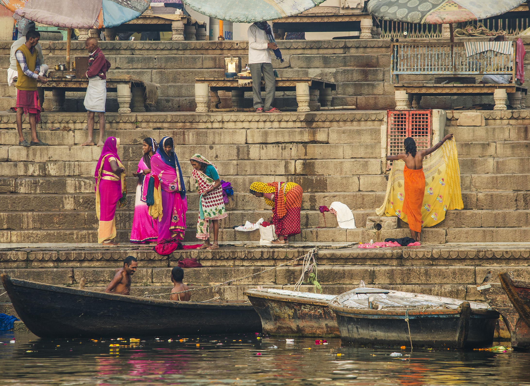 Daily morning rituals. The contrast between life and death: saris full of  life and colors, and the river where people go  to die.