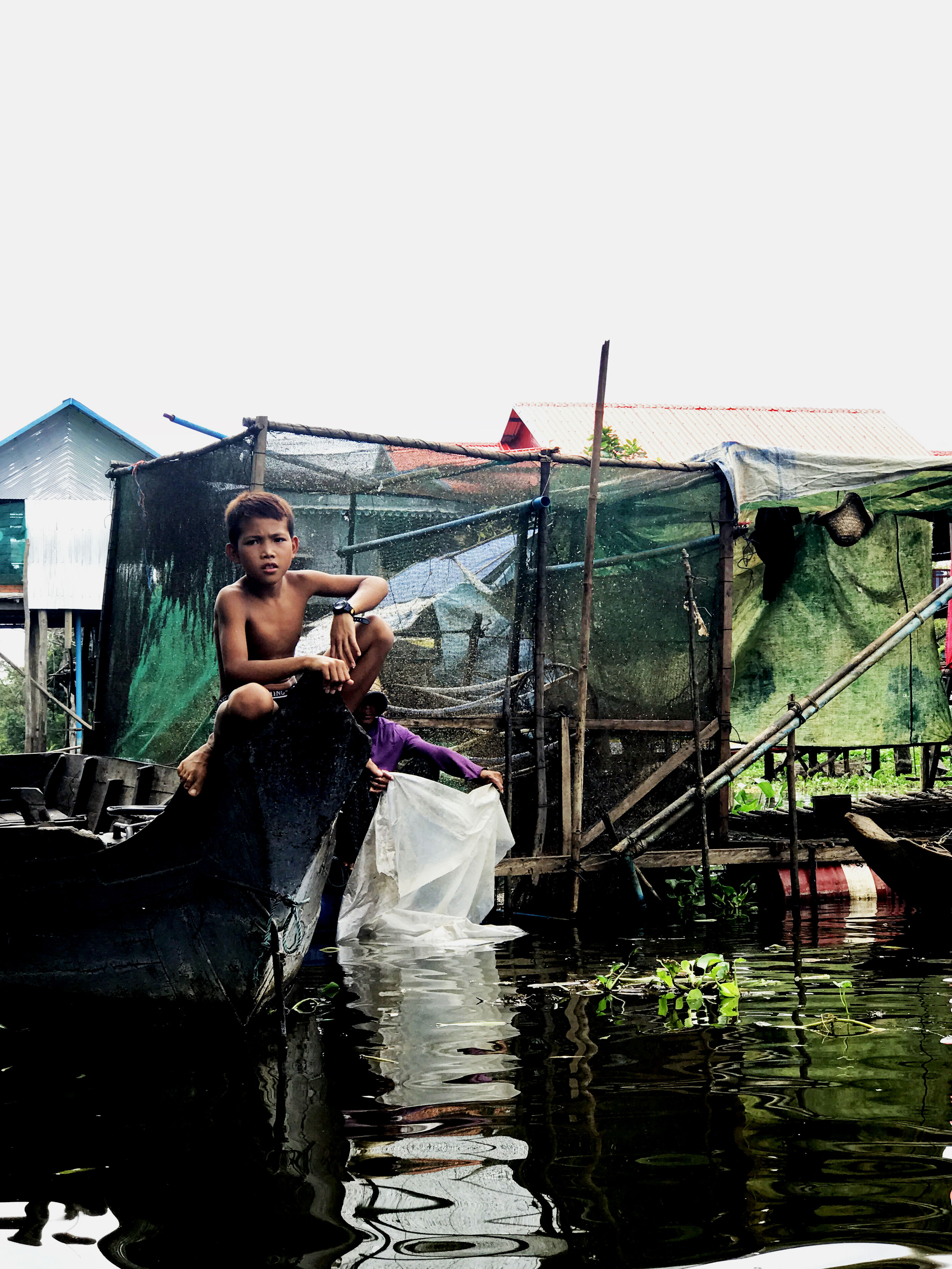 It laps against the fishing boats and the stilted houses, nestled among the flooded forest on the fringes of the seasonally inundated lake. Time is spent repairing fishing nets and sorting the catch. People live in harmony with the ecosystem. It is integral to all life here.  Water.