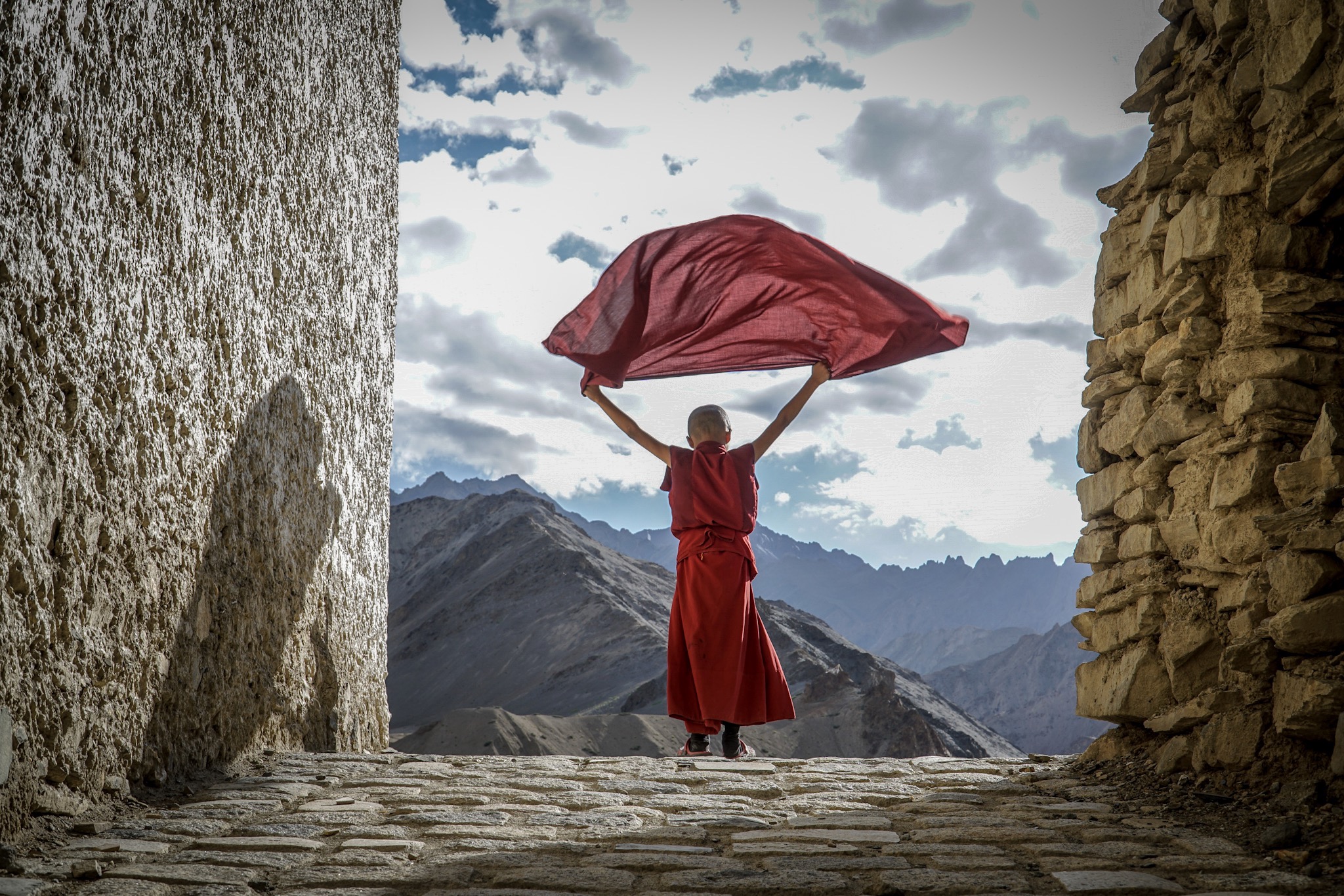 Like an Eagle soaring in these Himalayan mountains, the novice monk is on top of the world.