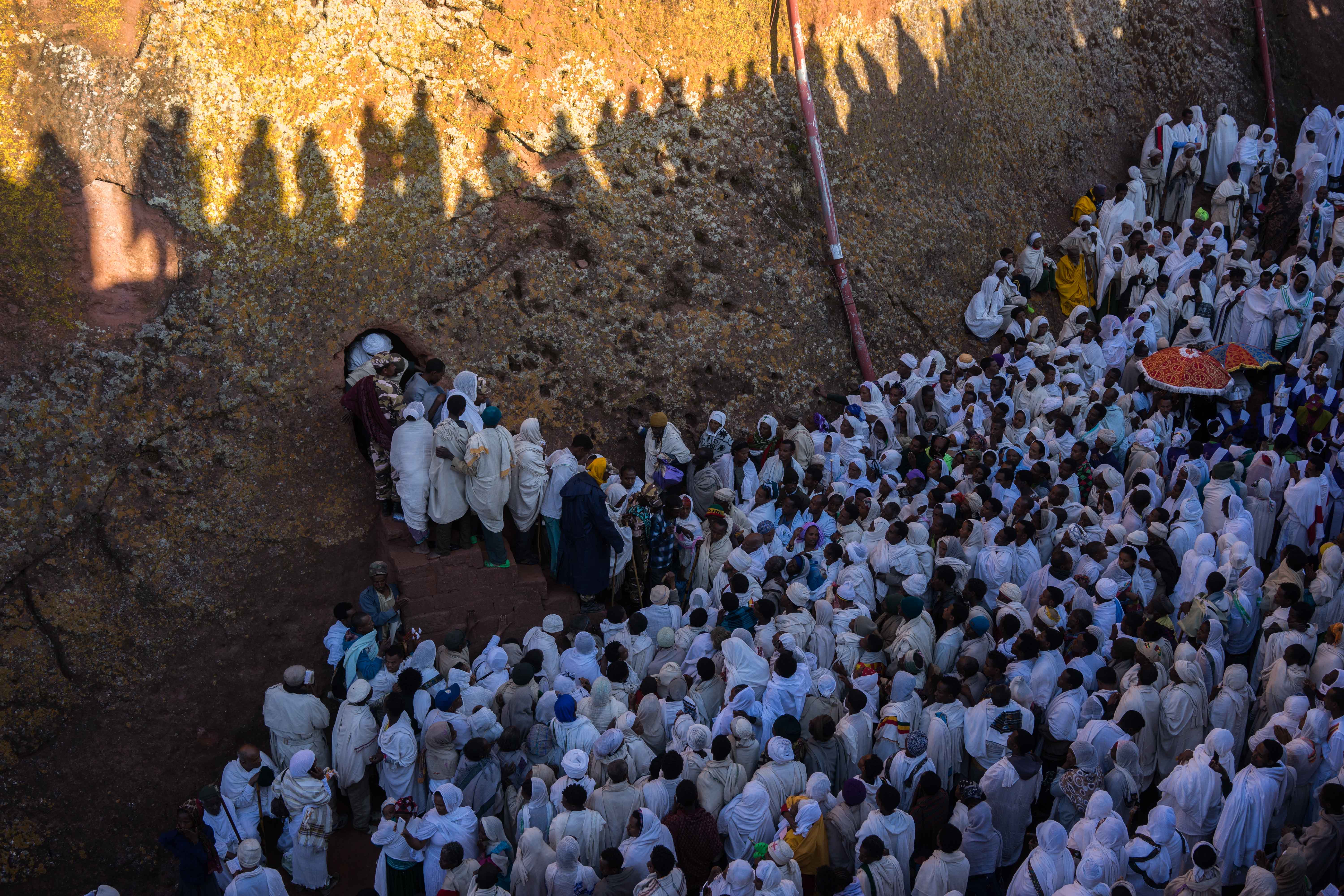 Every year thousands of people gather on Christmas day to pay homage in Lalibela, Ethiopia's most holy city.  Here, pilgrims prepare to enter one of Lalibela's many rock-hewn churches built in the 12th century as a 'New Jerusalem' after Muslim conquest hindered Christian passage to the holy land. 
