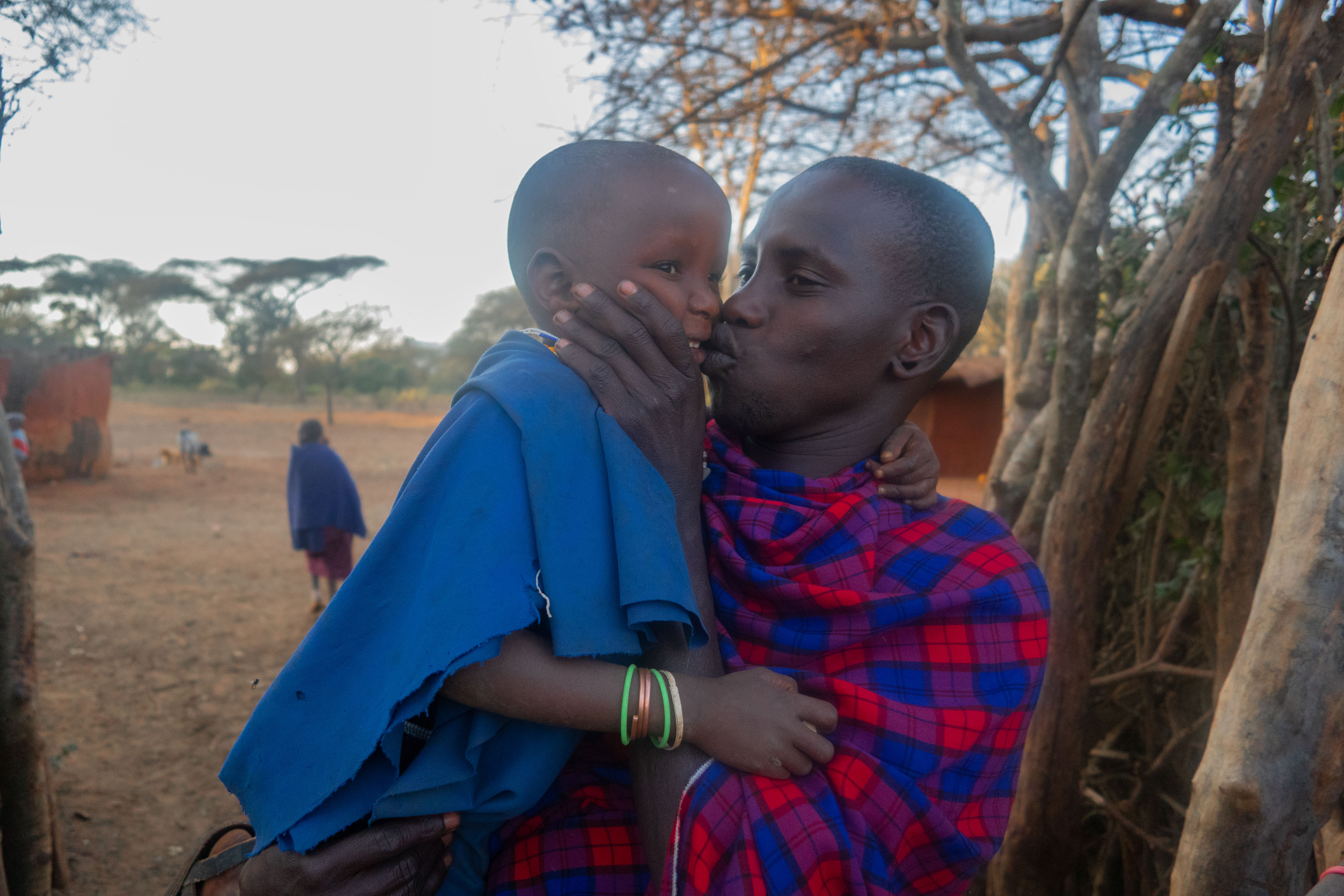 Father and daughter: Sangwa kisses his daughter, Nditolai, lovingly. As daughters grow up, their relationship with their father will become more polite and interactions more scarce, as this is the discipline of their culture. 