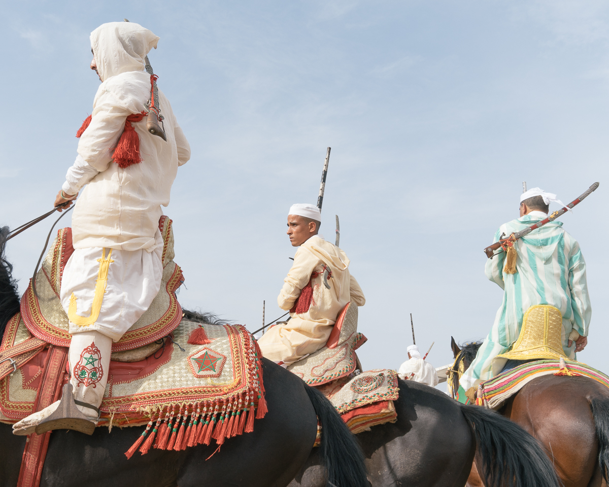 Before the run participants wait for their turn. Bouznika, Morocco, 2017.  Fantasia, stands for the breathtaking sport and equestrian art that has being practiced in Morocco and other Maghreb countries since the 8th Century. It is a tribal, rural and religious tradition.