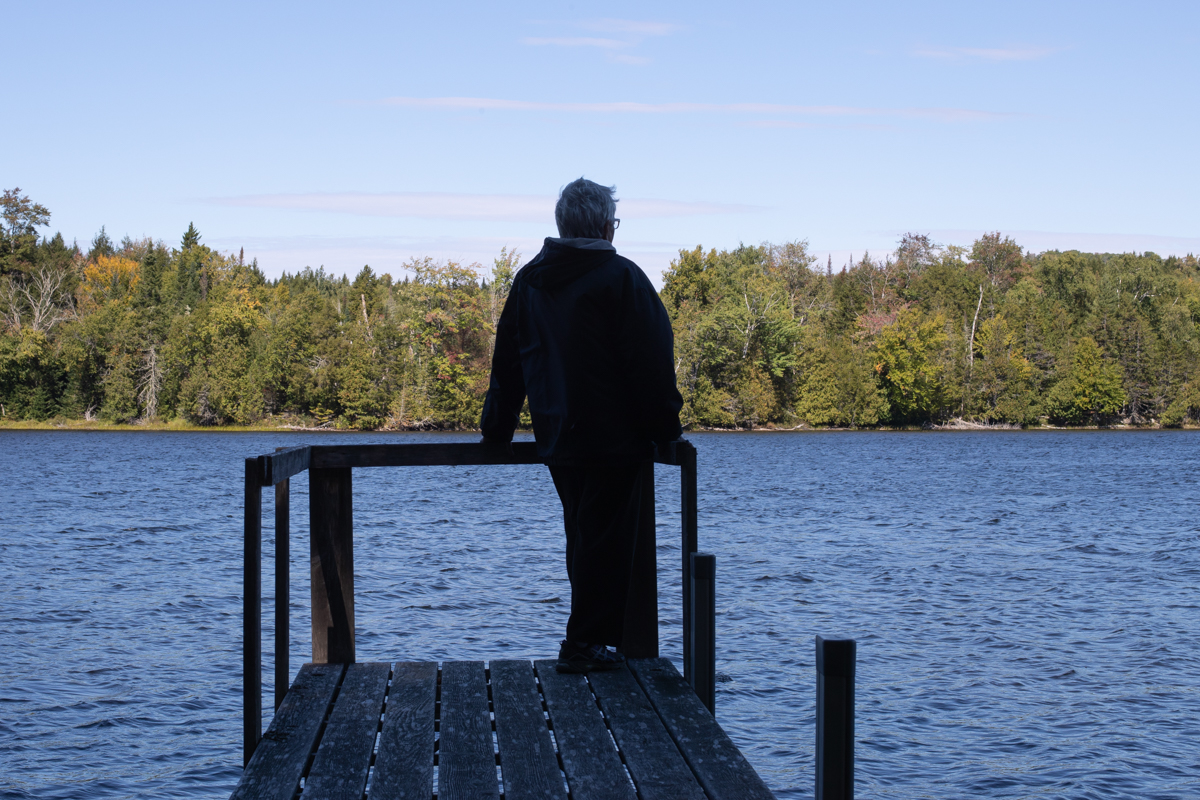 My grandmother taking one last stroke on the dock before it comes in for the season. 