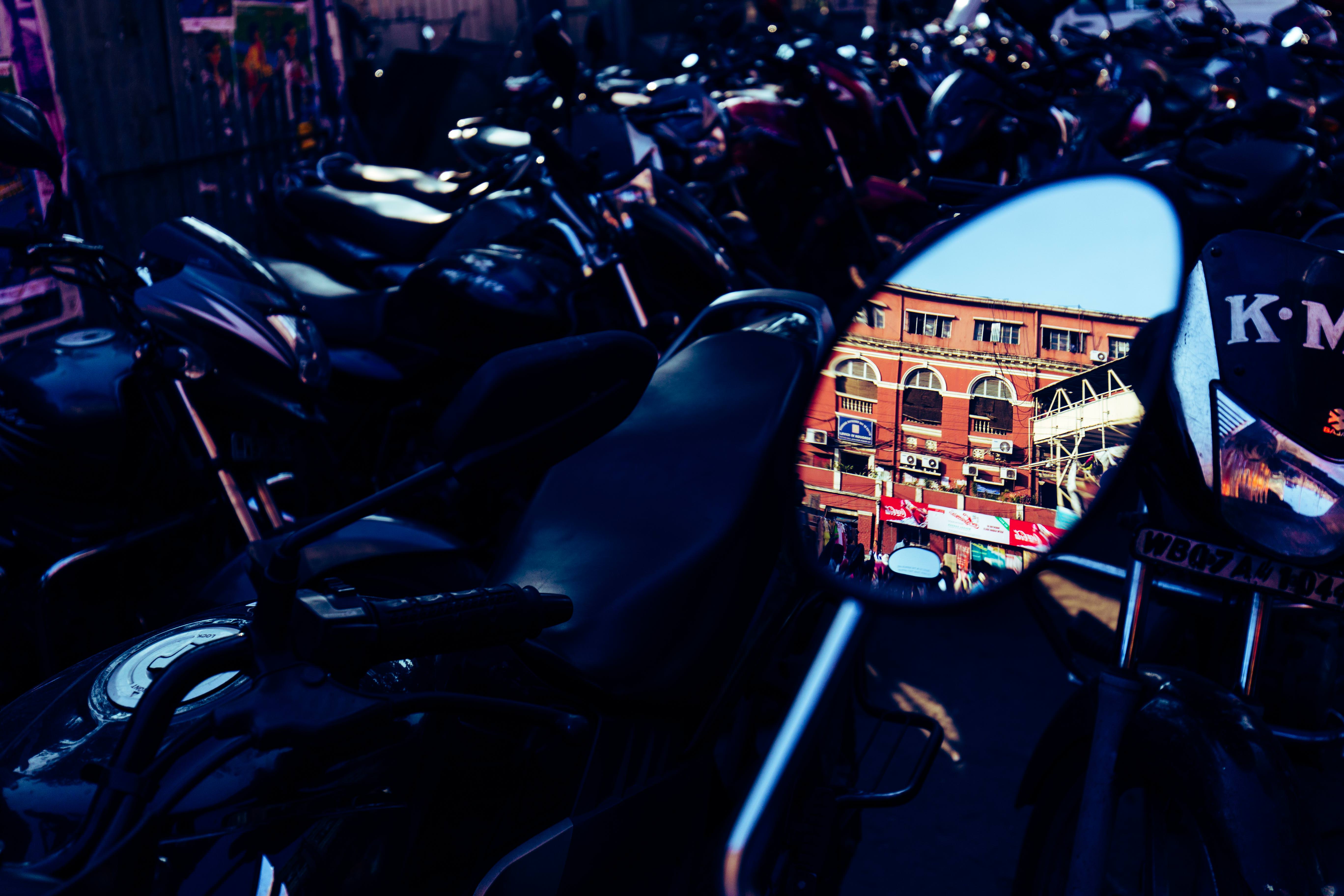 A brief reflection into the history of Kolkata near a Hog Market motorcycle stand, where one can observe the remnants of the long-gone British rule or Raj, in the very distinct form of red brick buildings which serve as government offices even today.
