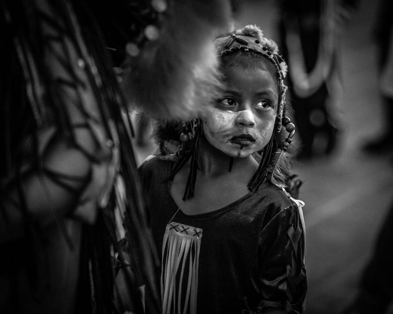 By the stare of the younglings, you can imagine how impressive the scene is. Like this little girl, staring at the hordes of Concheros who are screaming out loud and dancing to the rhythm of the drums.  