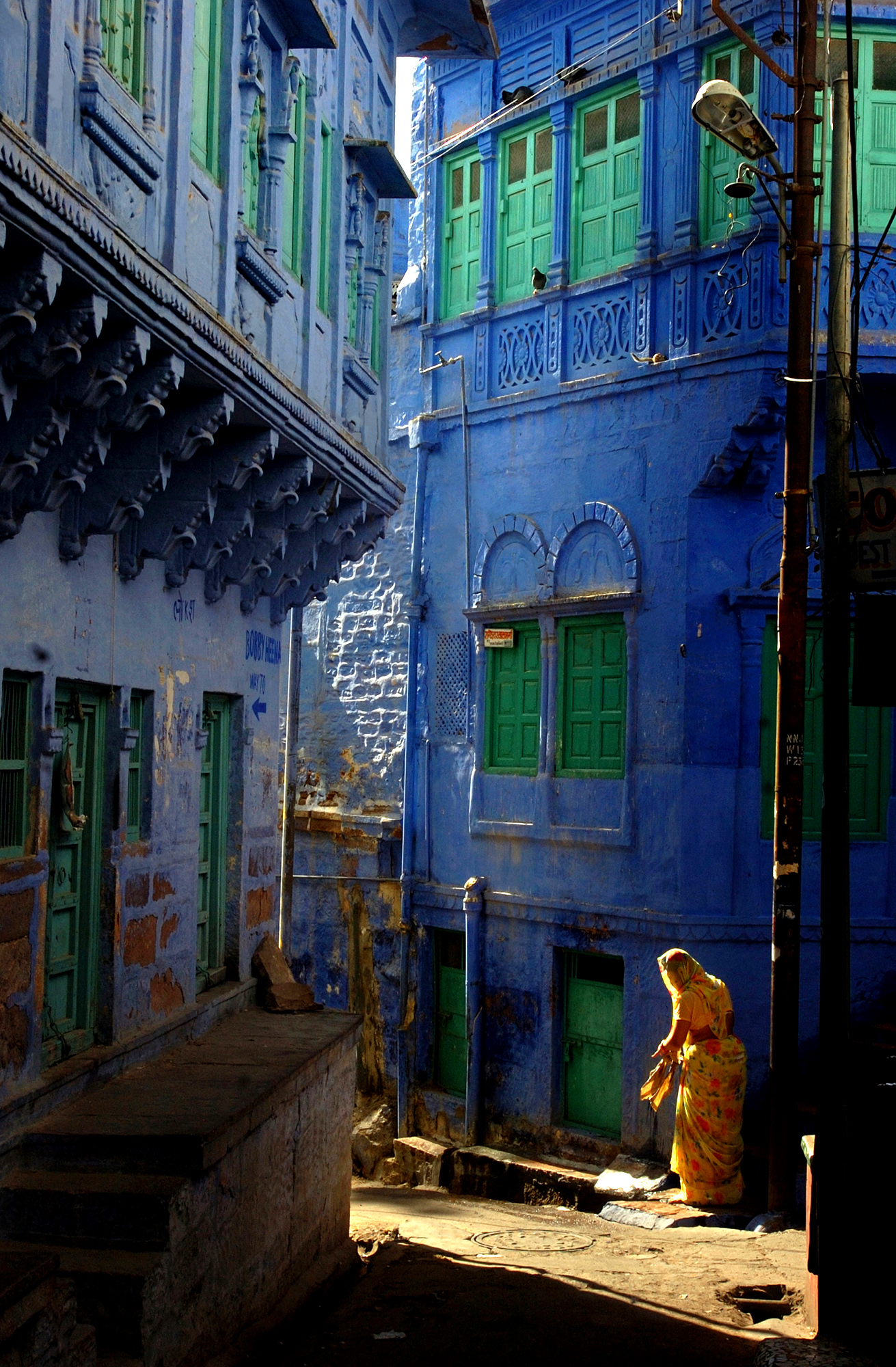 Cities prosaic termites were the main reason behind the colour Blue. This army was causing widespread structural damage in the settlement. To contain the menace, the houses were painted by adding chemicals such as copper sulphate to standard whitewash.
