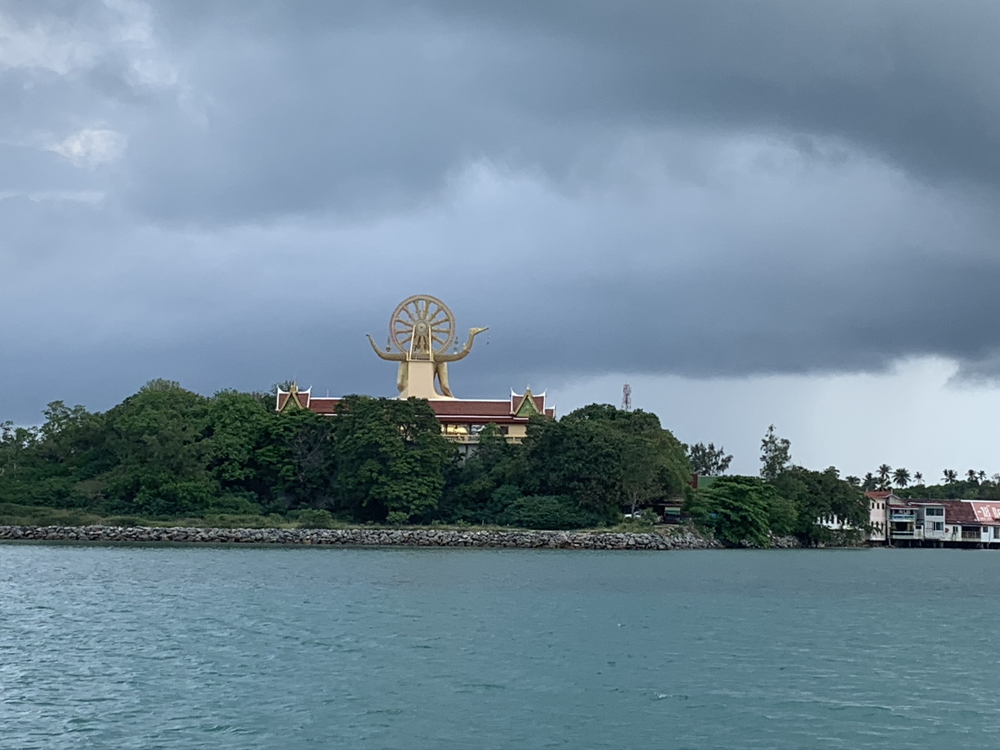 Boat ride in Tongsai Bay going to Leela Beach Resort, Ko Pha Ngan. Storm clouds rolling over made for a picturesque moment.